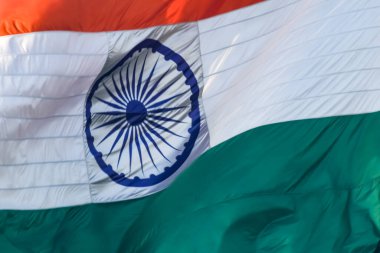 India flag flying high at Connaught Place with pride in blue sky, India flag fluttering, Indian Flag on Independence Day and Republic Day of India, tilt up shot, Waving Indian flag, Har Ghar Tiranga