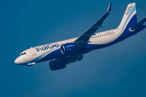 Stock image New Delhi, India, December 25 2023 - Indigo Airbus A320 take off from Indra Gandhi International Airport Delhi, Indigo domestic aeroplane flying in the blue sky during day time