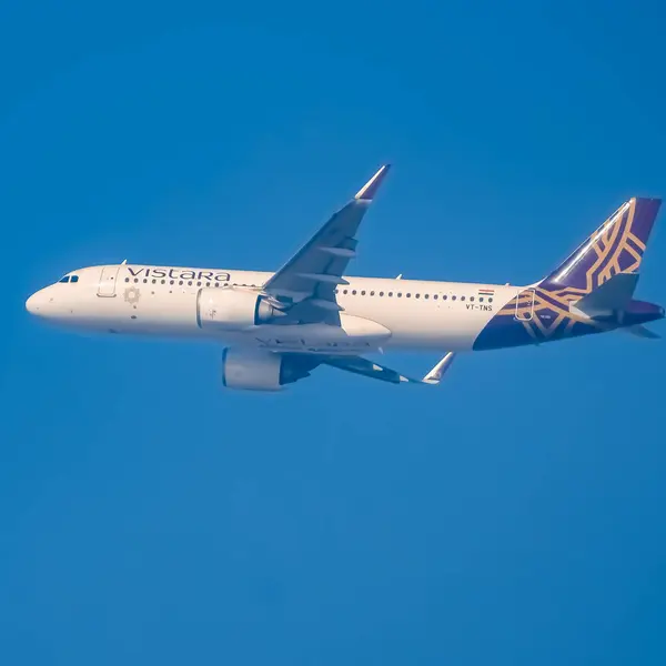 stock image New Delhi, India, December 25 2023 - Vistara Airbus A320 neo take off from Indra Gandhi International Airport Delhi, Vistara domestic aeroplane flying in the blue sky during day time