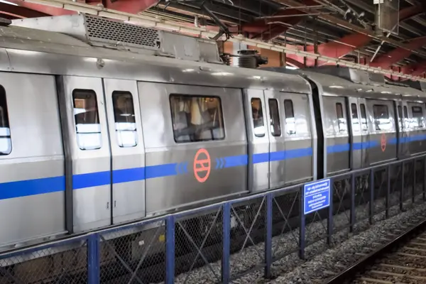 stock image New Delhi, India, February 17 2024 - Delhi Metro train arriving at Jhandewalan metro station in New Delhi, India, Asia, Public Metro departing from Jhandewalan station