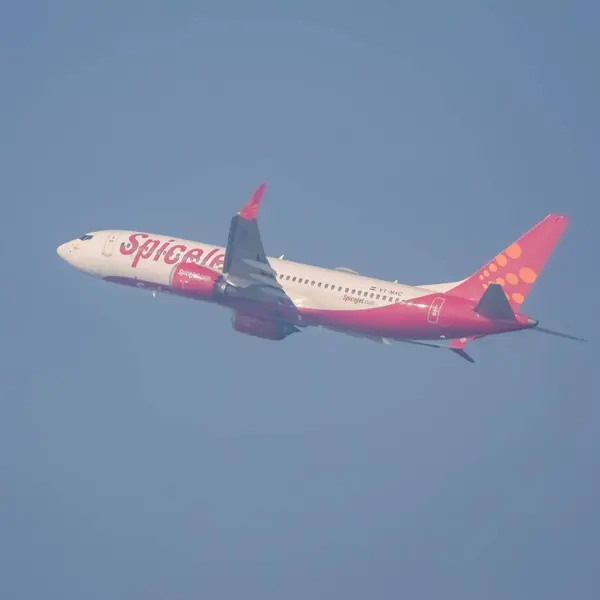 stock image New Delhi, India, December 25 2023 - Spicejet Airbus A320 take off from Indra Gandhi International Airport Delhi, Spicejet domestic aeroplane flying in the blue sky during day time