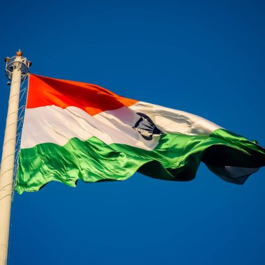 India flag flying high at Connaught Place with pride in blue sky, India flag fluttering, Indian Flag on Independence Day and Republic Day of India, tilt up shot, Waving Indian flag, Har Ghar Tiranga clipart