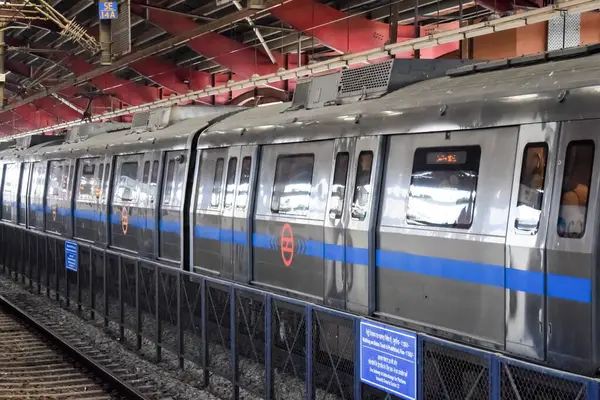 stock image New Delhi, India, February 17 2024 - Delhi Metro train arriving at Jhandewalan metro station in New Delhi, India, Asia, Public Metro departing from Jhandewalan station