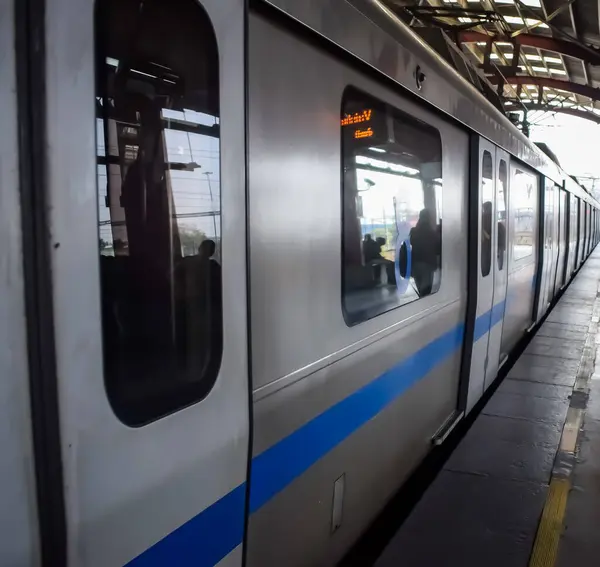 stock image New Delhi, India, February 17 2024 - Delhi Metro train arriving at Jhandewalan metro station in New Delhi, India, Asia, Public Metro departing from Jhandewalan station