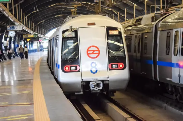 stock image New Delhi, India, February 17 2024 - Delhi Metro train arriving at Jhandewalan metro station in New Delhi, India, Asia, Public Metro departing from Jhandewalan station