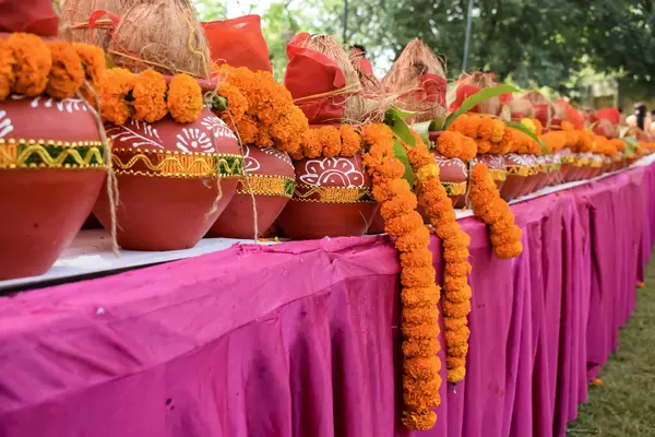 stock image Kalash with coconut and mango leaf with floral decoration earthen pots containing sacred water. Kalash for hindu puja during Jagannath Temple Mangal Kalash Yatra, front view, closeup