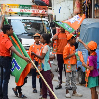 New Delhi, India - May 17 2024 - Thousands of people collected during Prime Minister Narendra Modi BJP road show, people during PM Modi big election rally in the capital clipart
