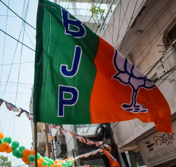 stock image New Delhi, India - May 23 2024 - Bharatiya Janata Party Flag of Indian political party, BJP Bhartiya Janta Party Flag Waving during PM road show in Delhi, India