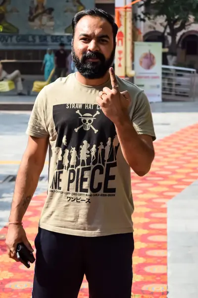 stock image New Delhi, India - May 25 2024 - Unidentified people showing their ink-marked fingers after casting votes in front of polling booth of east Delhi area for general Lok Sabha Elections 2024