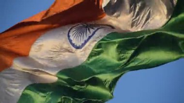 India flag flying high at Connaught Place with pride in blue sky, India flag fluttering, Indian Flag on Independence Day and Republic Day of India, tilt up shot, Waving Indian flag, Har Ghar Tiranga