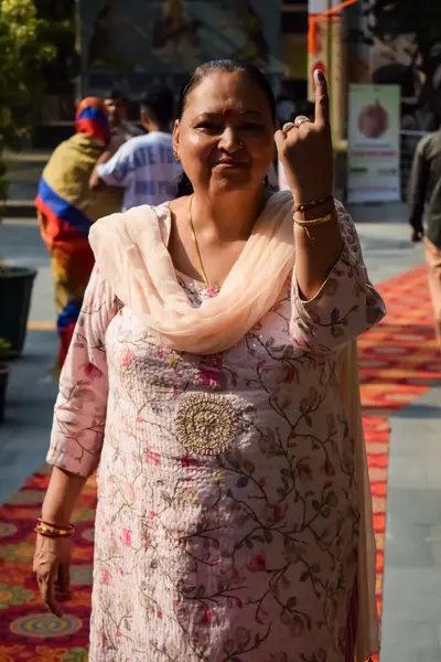 stock image New Delhi, India - May 25 2024 - Unidentified people showing their ink-marked fingers after casting votes in front of polling booth of east Delhi area for general Lok Sabha Elections 2024