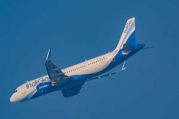 stock image New Delhi, India, June 10 2024 - Indigo Airbus A320 take off from Indra Gandhi International Airport Delhi, Indigo domestic aeroplane flying in the blue sky during day time