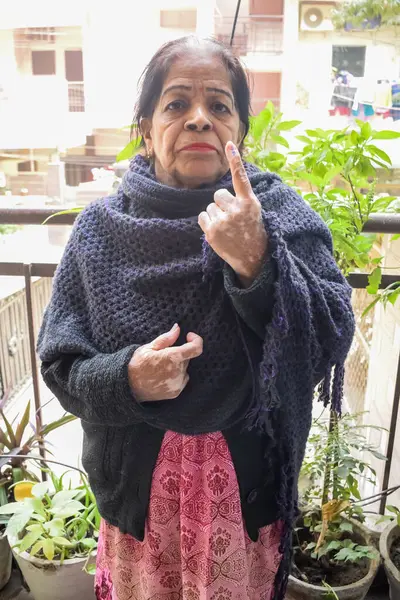 stock image New Delhi, India - May 25 2024 - Unidentified people showing their ink-marked fingers after casting votes in front of polling booth of east Delhi area for general Lok Sabha Elections 2024