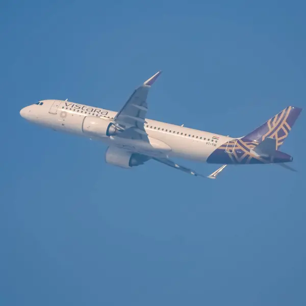 stock image New Delhi, India, June 10 2024 - Vistara Airbus A320 neo take off from Indra Gandhi International Airport Delhi, Vistara domestic aeroplane flying in the blue sky during day time