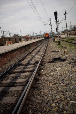 View of train Railway Tracks from the middle during daytime at Kathgodam railway station in India, Train railway track view, Indian Railway junction, Heavy industry clipart