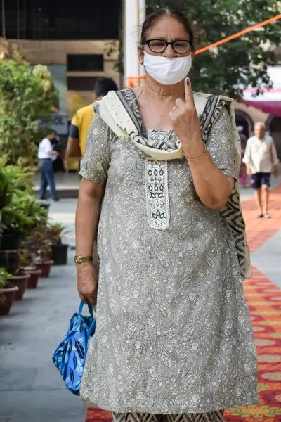 stock image New Delhi, India - May 25 2024 - Unidentified people showing their ink-marked fingers after casting votes in front of polling booth of east Delhi area for general Lok Sabha Elections 2024