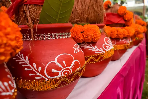 stock image Kalash with coconut and mango leaf with floral decoration earthen pots containing sacred water. Kalash for hindu puja during Jagannath Temple Mangal Kalash Yatra, front view, closeup