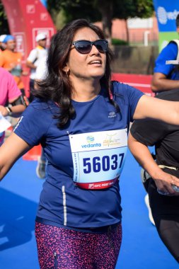 New Delhi, India - October 15 2023 - Vedanta Delhi Half Marathon race after covid in which marathon participants about to cross the finish line, Delhi Half Marathon 2023 clipart