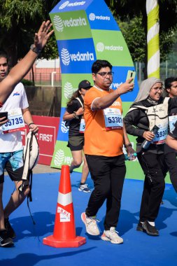 New Delhi, India - October 15 2023 - Vedanta Delhi Half Marathon race after covid in which marathon participants about to cross the finish line, Delhi Half Marathon 2023 clipart