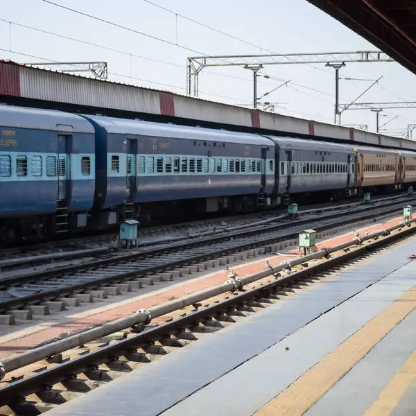 stock image Delhi, India, June 09 2024 - Indian railway express train at departure from Anand Vihar railway station during morning time, Colourful Express train at Delhi railway station