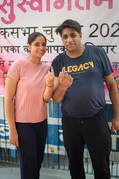 stock image New Delhi, India - May 25 2024 - Unidentified people showing their ink-marked fingers after casting votes in front of polling booth of east Delhi area for general Lok Sabha Elections 2024