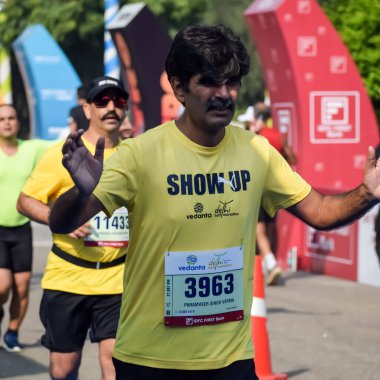 New Delhi, India - October 15 2023 - Vedanta Delhi Half Marathon race after covid in which marathon participants about to cross the finish line, Delhi Half Marathon 2023 clipart