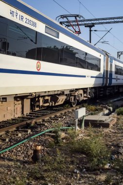 Delhi, India, June 09 2024 - Vande Bharat Express train going from Delhi towards Dehradun from Anand Vihar railway station, Vande Bharat fastest Train of India clipart