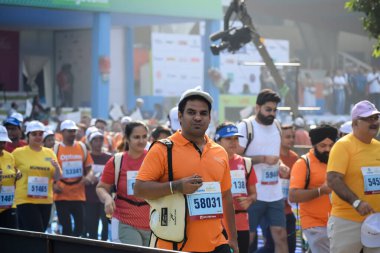 New Delhi, India - October 20 2024 - Vedanta Delhi Half Marathon race after covid in which marathon participants about to cross the finish line, Delhi Half Marathon 2024 clipart