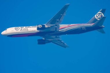 New Delhi, India, June 10 2024 - SF Airbus A320 take off from Indra Gandhi International Airport Delhi, SF international aeroplane flying in the blue sky during day time clipart