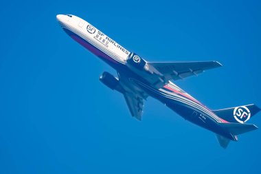 New Delhi, India, June 10 2024 - SF Airbus A320 take off from Indra Gandhi International Airport Delhi, SF international aeroplane flying in the blue sky during day time clipart