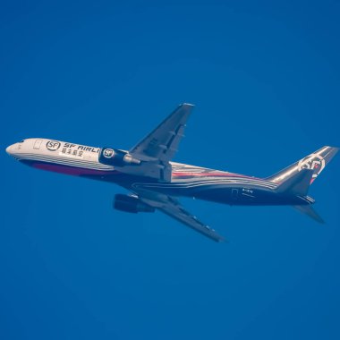 New Delhi, India, June 10 2024 - SF Airbus A320 take off from Indra Gandhi International Airport Delhi, SF international aeroplane flying in the blue sky during day time clipart