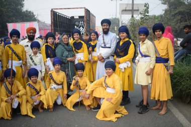 Delhi, India, November 17, 2024 - Sikhs display gatka and martial arts during annual Nagar Kirtan, Traditional, procession on account of birthday of Guru Nanak Dev ji, Nagar Kirtan in East Delhi area clipart