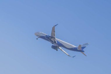 New Delhi, India, November 10 2024 - Indigo Airbus A320 take off from Indra Gandhi International Airport Delhi, Indigo domestic aeroplane flying in the blue sky during day time clipart