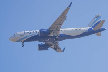 New Delhi, India, November 10 2024 - Indigo Airbus A320 take off from Indra Gandhi International Airport Delhi, Indigo domestic aeroplane flying in the blue sky during day time clipart