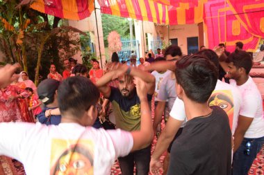 Delhi, India, October 09,2024 - Devotees performing spiritual dance in front of Durga Idol, Durga Puja celebration at Kali Bari temple in Jhilmil Colony Delhi, Durga utsav festival in Oct 2024 clipart