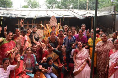 Delhi, India, October 09,2024 - Devotees performing spiritual dance in front of Durga Idol, Durga Puja celebration at Kali Bari temple in Jhilmil Colony Delhi, Durga utsav festival in Oct 2024 clipart