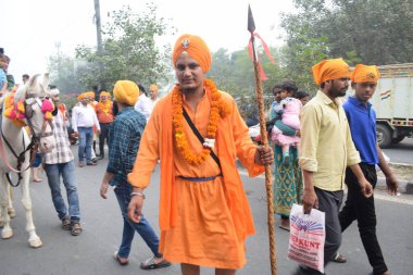 Delhi, India, November 17, 2024 - Sikhs display gatka and martial arts during annual Nagar Kirtan, Traditional, procession on account of birthday of Guru Nanak Dev ji, Nagar Kirtan in East Delhi area clipart