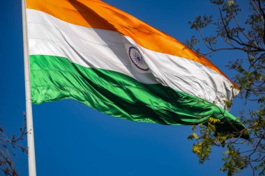 India flag flying high at Connaught Place with pride in blue sky, India flag fluttering, Indian Flag on Independence Day and Republic Day of India, tilt up shot, Waving Indian flag, Har Ghar Tiranga clipart