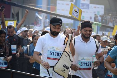 New Delhi, India - October 20 2024 - Vedanta Delhi Half Marathon race after covid in which marathon participants about to cross the finish line, Delhi Half Marathon 2024 clipart