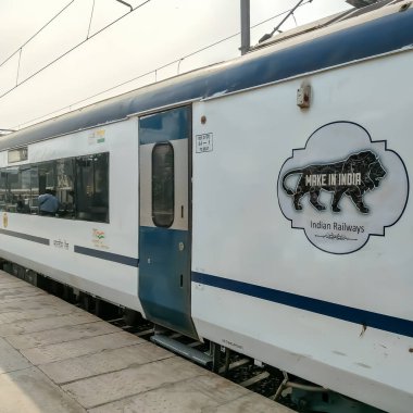 Delhi, India, Dec 31 2024 - Vande Bharat Express train going from Delhi towards Dehradun from Anand Vihar railway station, Vande Bharat fastest Train of India clipart