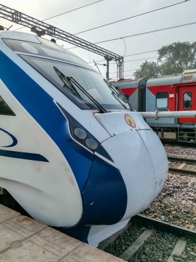 Delhi, India, Dec 31 2024 - Vande Bharat Express train going from Delhi towards Dehradun from Anand Vihar railway station, Vande Bharat fastest Train of India clipart