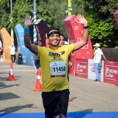 New Delhi, India - October 20 2024 - Vedanta Delhi Half Marathon race after covid in which marathon participants about to cross the finish line, Delhi Half Marathon 2024 clipart