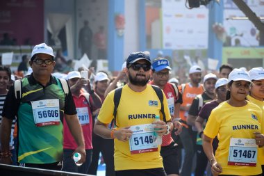 New Delhi, India - October 20 2024 - Vedanta Delhi Half Marathon race after covid in which marathon participants about to cross the finish line, Delhi Half Marathon 2024 clipart