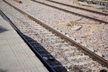 View of train Railway Tracks from the middle during daytime at Anand Vihar railway station in India, Train railway track view, Indian Railway junction, Heavy industry clipart