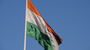 India flag flying high at Connaught Place with pride with plain white background, India flag fluttering, Indian Flag on Independence Day and Republic Day of India, tilt up shot, Har Ghar Tiranga