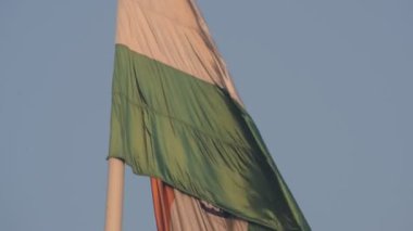 India flag flying high at Connaught Place with pride with plain white background, India flag fluttering, Indian Flag on Independence Day and Republic Day of India, tilt up shot, Har Ghar Tiranga
