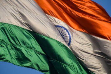 India flag flying high at Connaught Place with pride with plain white background, India flag fluttering, Indian Flag on Independence Day and Republic Day of India, tilt up shot, Har Ghar Tiranga