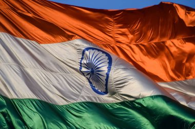 India flag flying high at Connaught Place with pride with plain white background, India flag fluttering, Indian Flag on Independence Day and Republic Day of India, tilt up shot, Har Ghar Tiranga