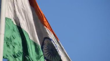 India flag flying high at Connaught Place with pride with plain white background, India flag fluttering, Indian Flag on Independence Day and Republic Day of India, tilt up shot, Har Ghar Tiranga