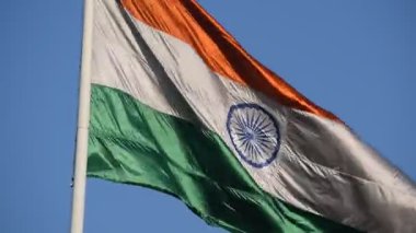 India flag flying high at Connaught Place with pride with plain white background, India flag fluttering, Indian Flag on Independence Day and Republic Day of India, tilt up shot, Har Ghar Tiranga